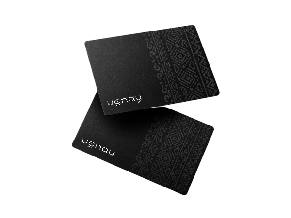 Two matte black Ugnay NFC cards
